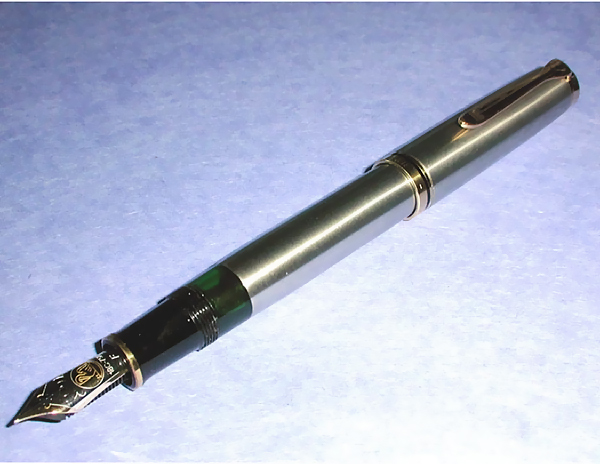 From the collection of Rick Propas/photography by Rick Propas. Pen made of Pelikan M800 components sheathed in Titanium by Grayson Tighe, 2001.